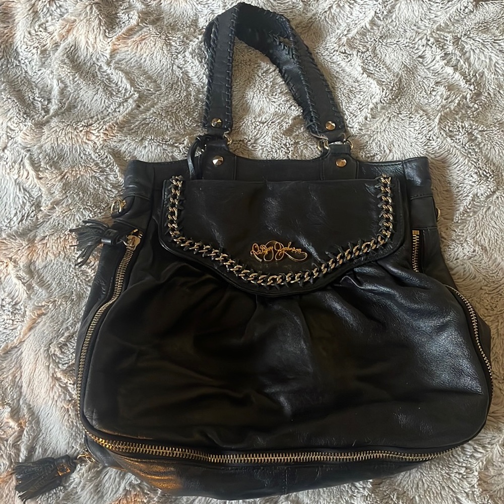Large leather, Betsey Johnson handbag. Storing bag included.